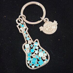Hard Rock Cafe Nashville Guitar Keychain With Blue & Silver Musical Notes Design